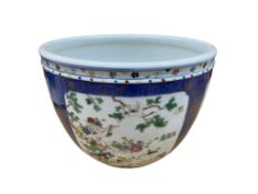 A Chinese or Samson porcelain powder blue jardinere enamelled with birds and flowers, 21cm high x