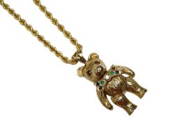 A modern 9ct gold and gem set articulated teddy bear pendant, overall 35mm, on a 9ct gold rope twist