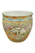 A modern Chinese famille rose planter enamelled with birds and flowers, 31cm in diameter