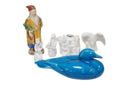 A group of Chinese porcelain and pottery figures to include blanc de chine examples and a