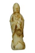 A miniature Chinese white and russet jade figure of Gnanyin, 5.5cm high