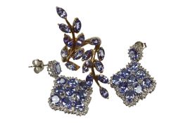 A recent 9ct gold and tanzanite cluster up-finger ring, of foliate design, size N, gross weight 5.