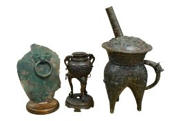 A Chinese archaistic bronze tripod vessel, a Japanese bronze koro and a section of a bronze Hu