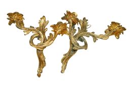 A pair of Rococo style gilt metal twin branch wall candle lights, height 33cm