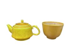 A Chinese yellow glazed cup, Guangru mark and a similar teapot, decorated with dragons chasing the