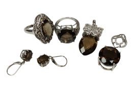 A collection of recent 925 and smoky quartz jewels, to include two rings, two pendant and a pair