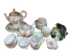A quantity of Dresden and other German porcelain teawares a German bird and fruiting nest wall