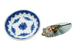 A small Chinese blue and white dish, diameter 8cm, and a decorative porcelain snuff bottle
