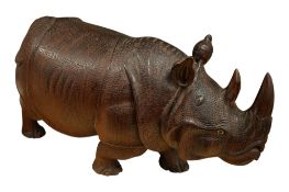 A large West African hardwood model of rhinoceros, 56cm wide