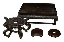 Four hardwood Chinese stands to include a large rectangular example, 38 x 31cm