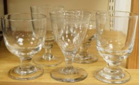 An early 19th century wine glass with tear drop stem, height 16cm, and four 19th century and later