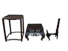 Three Chinese hardwood vase and dish stands, largest 20cm high