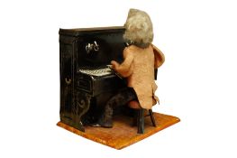 A French F.M.Systeme tin plate clockwork toy pianist, height 16cm.