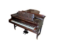 An early 20th century Bechstein rosewood Model C grand piano, on square tapered legs, with brass