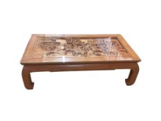 A Chinese carved coffee table, width 127cm, depth 66cm, height 41cm
