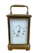 An early 20th century lacquered brass carriage clock, height 14cm.