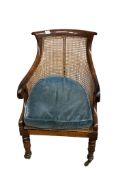 A William IV rosewood and canework bergère chair, width 54cm, depth 60cm, height 94cm