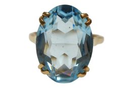 A 9ct gold and synthetic oval cut blue spinel ring, size R, gross weight 5.9 grams.