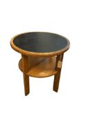 An Art Deco style circular oak two tier occasional table, diameter 61cm, height 62cm