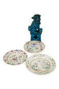 Three 18th century Chinese export dishes, largest 26cm diameter and a Turquoise glazed lion dog (4)
