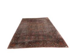 A Persian red ground carpet, 350 x 267cm