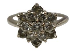 A modern 18ct white gold and diamond set flowerhead cluster ring, size M, gross weight 4.5 grams.