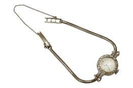 A lady's white metal, stamped plat and diamond set cocktail watch, on a 9ct white metal bracelet,