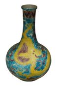 A Chinese fahua decorated 'dragon' baluster bottle vase, height 33cm.