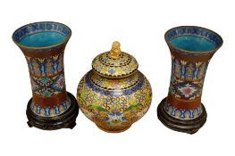 A pair of modern Chinese cloisonne vases with wood stands, height 19cm and champleve vase and