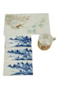 Four Chinese porcelain plaques, largest 24 x 13cm and a Chinese export famille rose coffee can (5)