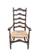 An American rush seat ladder back elbow chair, width 61cm, depth 50cm, height 123cm