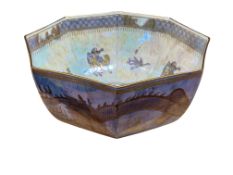 A Wedgwood octagonal lustre bowl, Orientalist style with dragons, mounted figures and birds,