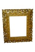 A 19th century giltwood frame carved with acanthus leaves, aperture size 59 x 47cm