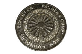 A Victorian ‘Palmer & Company Founders Brighton’ cast iron man hole cover, diameter 32cm.