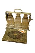 A Victorian silver plated tantalus, a mid 19th century brass inlaid book cover and a Royal Worcester