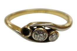 An 18ct and diamond three stone diamond set crossover ring, one stone loose but present, size M/N,