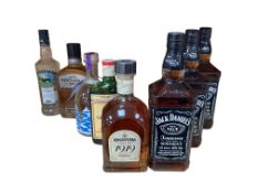Three bottles of Jack Daniel’s Whiskey, a bottle of Gentleman Jack Whiskey, a bottle of Angostura