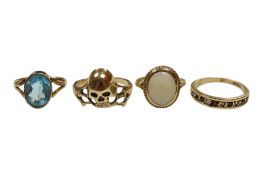 An unmarked yellow metal skull ring, size Q, together with a 9ct gold and white opal ring, a 9ct