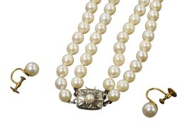 A Mikimoto double strand cultured pearl necklace, with cultured pearl set white metal clasp