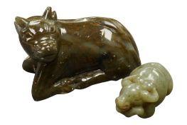 A Chinese green jade buffalo and a soapstone buffalo, largest 9cm wide (2)