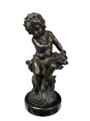 After Moreau. A patinated bronze figure of a seated youth with a basket, signed to the base,