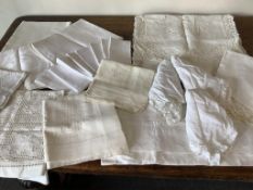 A set of eight picnic napkins Drew &Sons, damask cloths, an ornate Anglaise and Cluny lace edged