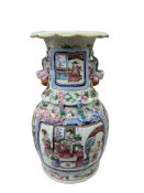 A 19th century Chinese famille rose vase with enamelled figural panels, height 33cm.