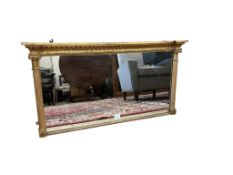 A 19th century gilt overmantel mirror, with breakfront cornice over twin Ionic columns, width 102cm,