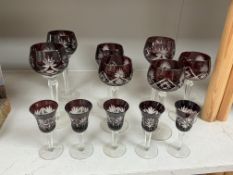 Twelve Bohemian flash cut ruby wine and liqueur glasses to include hock examples, largest 21cm high