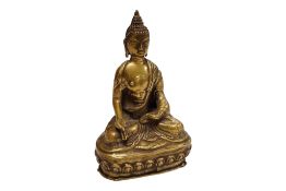 A Tibetan seated figure of Buddha, 12cm high