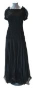 A late 1930’s early 40’s black silk chiffon and silk net evening gown. The dress designed with an