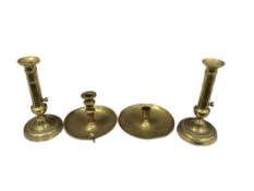 Four Georgian brass candle and chambersticks, three with telescopic action, largest 23cm high