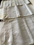 Three Irish linen double sheets, with different embroidery patterns on the turn backs, all are