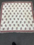 An early 19th century silk and wool cream ladies Norwich shawl. Woven with red and blue all over
